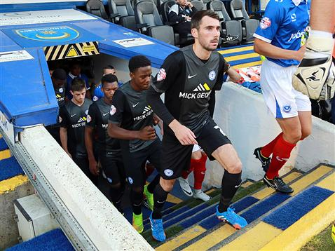 Michael Smith enters the pitch to make his debut for Posh v Portsmouth